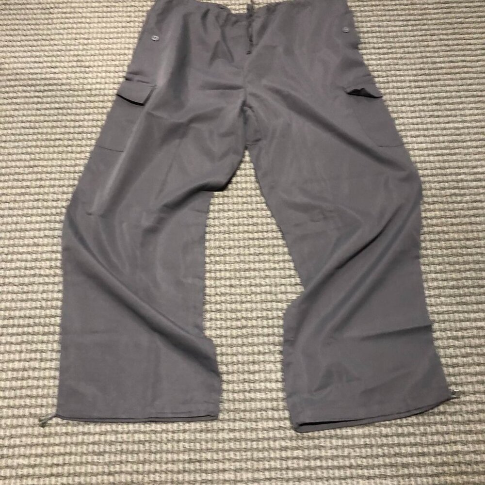 Extremely baggy grey parachute pants with adjustable waist